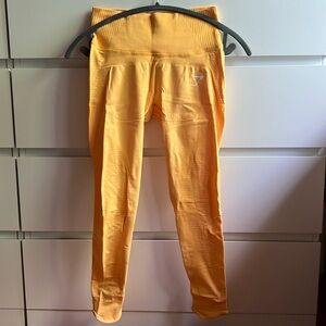 Gymshark leggings. Orangish yellow. Size small